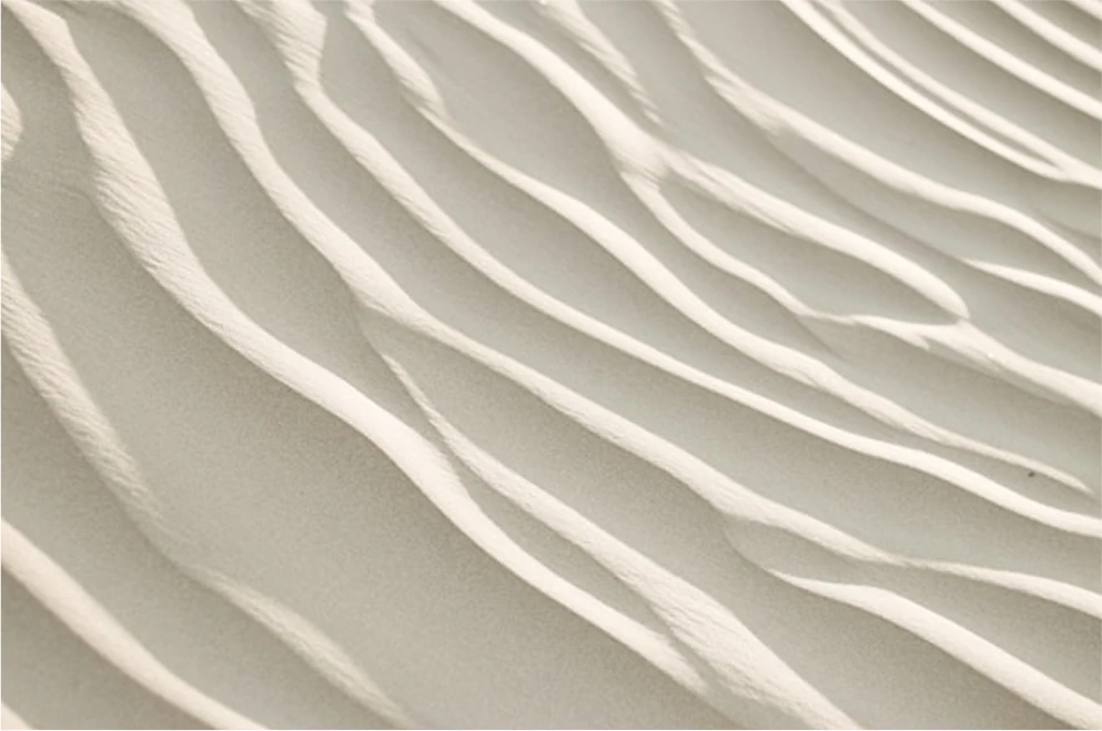 Textures de sable avec des ondulations douces.